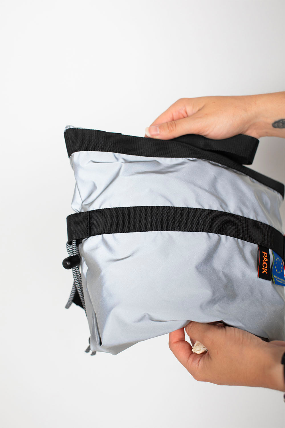 PACK BAGS - SMALL ZIP SLING - SILVER REFLECTIVE